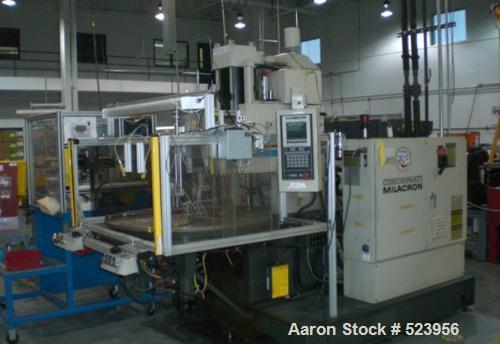 USED: Cincinnati Milacron 70 ton, model CH-70-R, injection molding machine, 4.4 oz. Manufactured 1995. Platen size 10" x 16". Stroke 12". Table configuration rotary, Camac VSX control, light curtains.