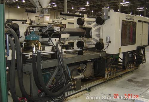 USED: Cincinnati Milacron 440 ton, model VT-440-54, injectionmolding machine, 54 oz. Manufactured 1995. Tie bar spacing 28.9" x28.9". Platen size 39.4" x 39.4". Clamp type toggle, clamp stroke25.6". ...