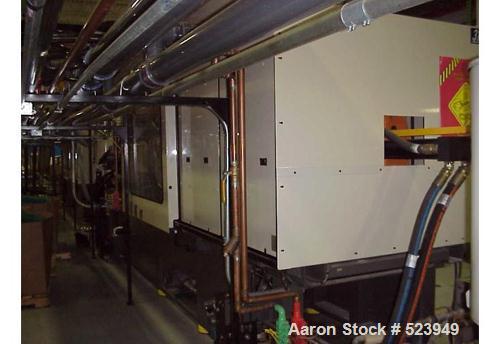 USED: Cincinnati Milacron 440 ton, model VT440-41, injection molding machine, 41 oz. Manufactured 1998. Tie bar spacing 28.9" x 28.9". Platen 39.4" x 39.4". Clamp toggle, clamp stroke 25.6". Daylight...