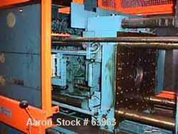 USED: Demag 60 ton injection molding machine, model D60-151. Distance between tie bars 12-1/2", platen size 19-1/2" x 21-1/2", fully open 19", 3/60/460 volt, NCII control panel with video display.