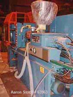 USED: Demag 60 ton injection molding machine, model D60-151. Distance between tie bars 12-1/2", platen size 19-1/2" x 21-1/2", fully open 19", 3/60/460 volt, NCII control panel with video display.