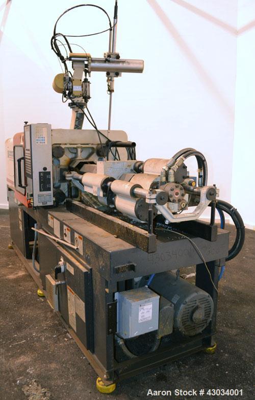 Used Ferromatik Milacron Vista V Series Toggle Injection Molder, 85 Ton, Model VV-85-4.44. Clamp stroke 11", maximum daylight 24". Mold height maximum/minimum 13"/4.9". Platen size 22" x 19.7". Tie r...