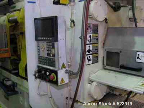 USED: 300 ton, 32 oz, HPM injection molding machine, model T300-32. New 1997. 41,505 hours. Platen size 36.5" x 36.8". Distance between tie bars 24.5" x 24.5". Clamp stroke 22.0". Maximum daylight 44...