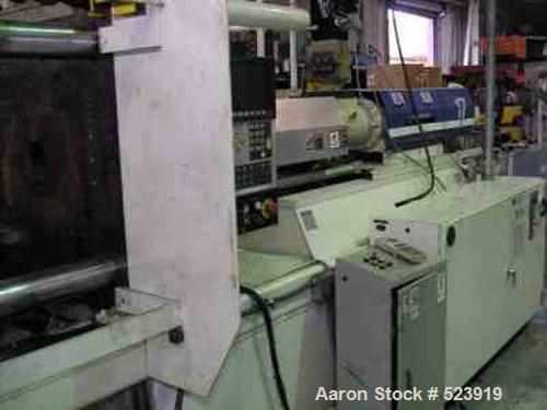 USED: 300 ton, 32 oz, HPM injection molding machine, model T300-32. New 1997. 41,505 hours. Platen size 36.5" x 36.8". Distance between tie bars 24.5" x 24.5". Clamp stroke 22.0". Maximum daylight 44...