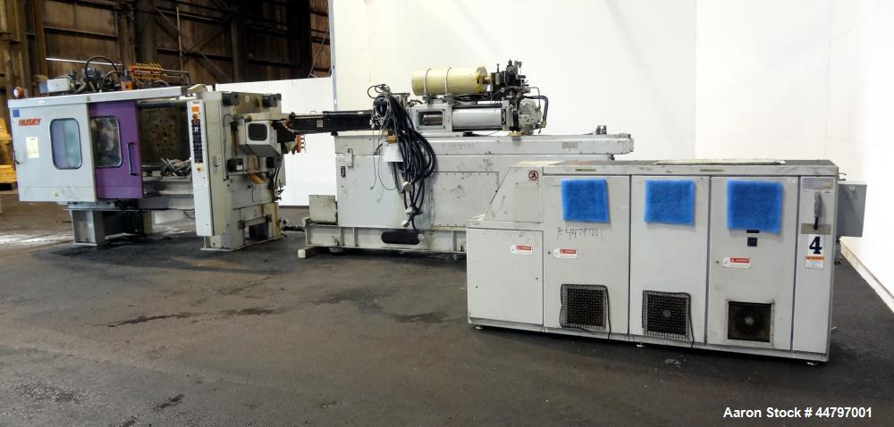 Used Husky Horizontal Injection Mold Machine, 300 Tons, Model SX300 RS60/50. Platen Size: 40.79" x 40.79". Distance Between 4.5" Tie Bars: 28.35" x 28.35". Clamp Stroke: 25.59". Shut Height Minimum/M...
