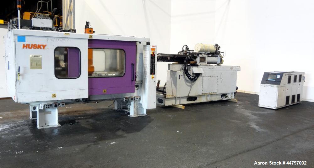 Used Husky Horizontal Injection Mold Machine, 300 Tons, Model SX300 RS60/50. Platen Size: 40.79" x 40.79". Distance Between 4.5" Tie Bars: 28.35" x 28.35". Clamp Stroke: 25.59". Shut Height Minimum/M...