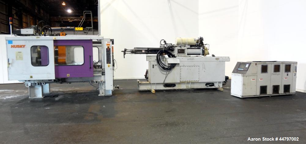 Used Husky Horizontal Injection Mold Machine, 300 Tons, Model SX300 RS60/50. Platen Size: 40.79" x 40.79". Distance Between 4.5" Tie Bars: 28.35" x 28.35". Clamp Stroke: 25.59". Shut Height Minimum/M...
