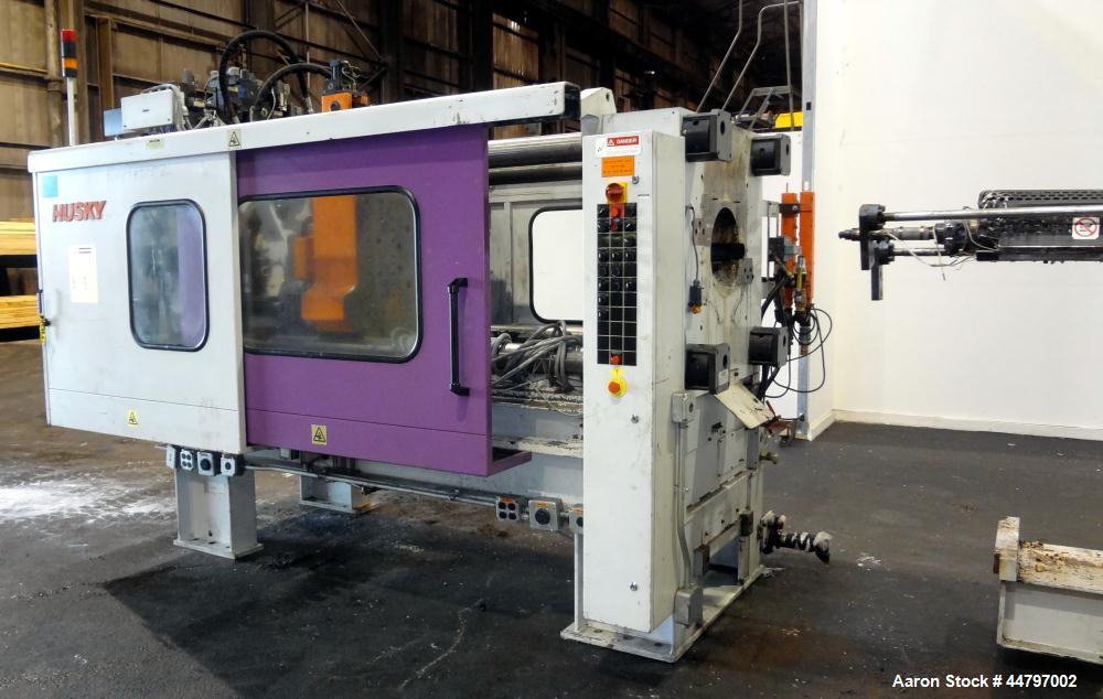 Used Husky Horizontal Injection Mold Machine, 300 Tons, Model SX300 RS60/50. Platen Size: 40.79" x 40.79". Distance Between 4.5" Tie Bars: 28.35" x 28.35". Clamp Stroke: 25.59". Shut Height Minimum/M...