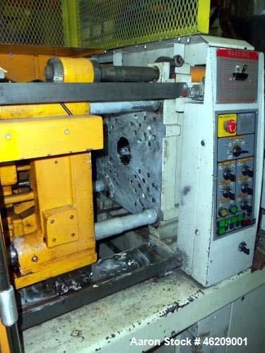 Used Kawaguchi Injection Molding Machine, Model KM50B2. 50 Ton clamping force. Space between tie bars 310 mm x 310mm. Platen size 450 mm x 445mm, 150 mm minimum mold height, 300 mm maximum mold heigh...