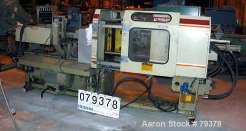 USED: Negro Bossi injection molding machine, model NB-130. Built 1986. 30 ton clamping pressure. Platen size 25" wide x 25" high. Distance between 2-3/4" tie bars 16" left to right, 16" top to bottom...