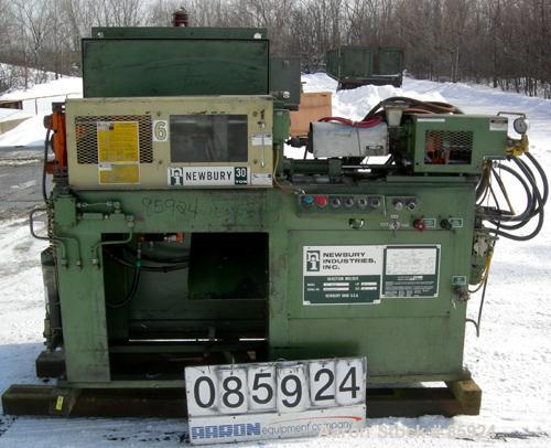 Used Newbury Industries Toggle Injection Molding Machine, Model HI30RS, 30 Ton. Platen size approximately 12-1/2" x 11". Distance between 1-1/2" diameter tie bars approximately 8-3/4" left to right x...