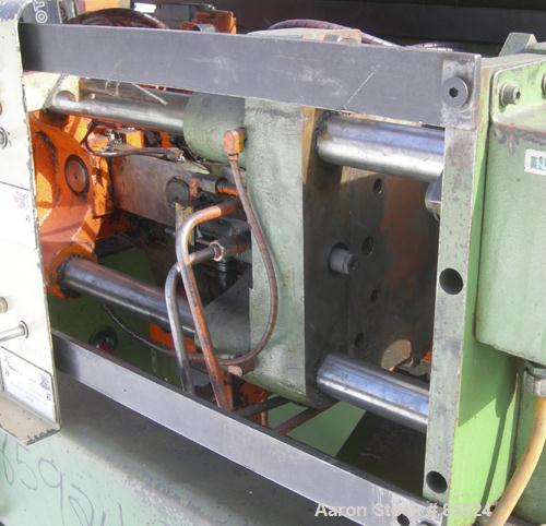 Used Newbury Industries Toggle Injection Molding Machine, Model HI30RS, 30 Ton. Platen size approximately 12-1/2" x 11". Distance between 1-1/2" diameter tie bars approximately 8-3/4" left to right x...