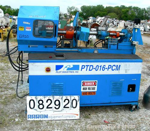 USED: Pilot Industries 16 ton hydraulic injection molding machine, model PTD-016-PCM. Approx mold size 6" x 8". (2) 2-1/2" diameter tie bars, approx 1" diameter screw. Used 7457 hours.
