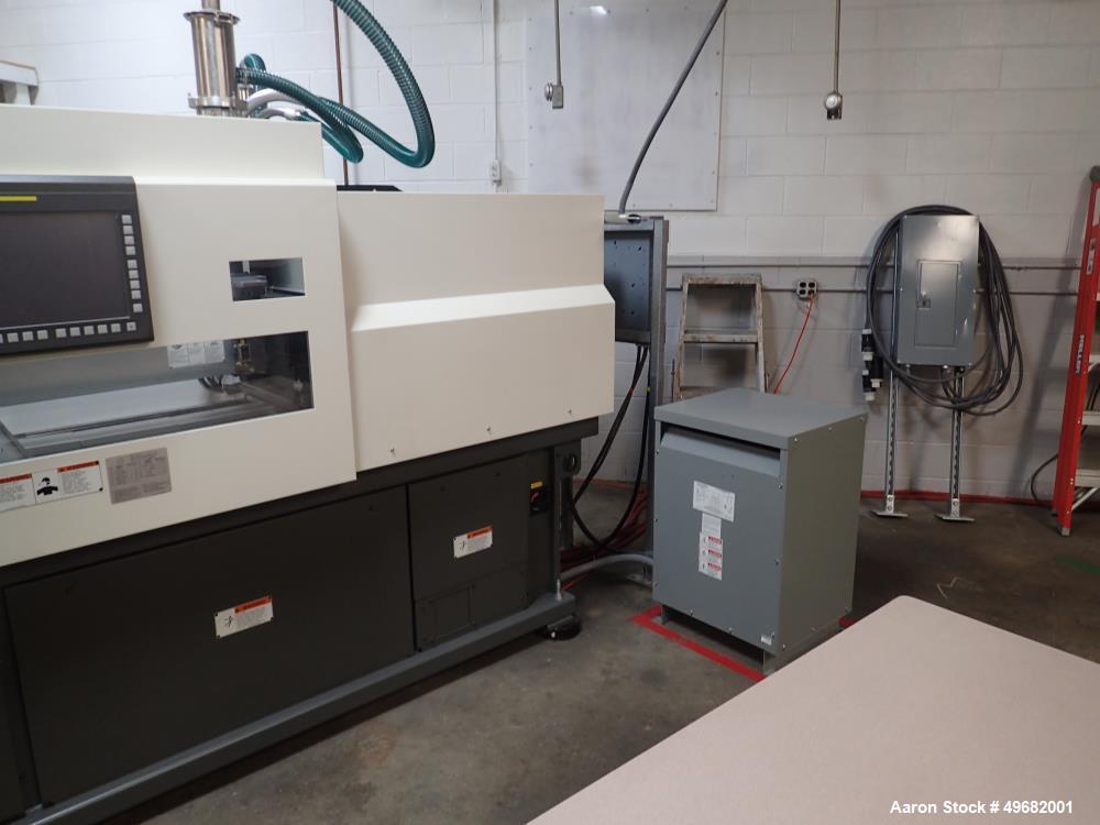 Used Milacron Roboshot 110 Ton Injection Molding Machine, Model S100i. Includes Moldmasters temp control Temp Master M2, Model #M2XS-12-MTS. Milacron Thermolator Model # MFCH7-75P. Dryer/hopper loadi...