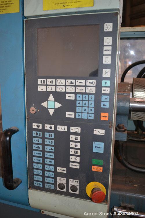 Used Sandretto Micro30 30 Ton Hydraulic Horizontal Injection Mold Machine, Model 300/107. Approximate 1-3/4" diameter tie bars, 12" x 12" distance between bars, 17-3/4" x 17-3/4" platen size. Operato...
