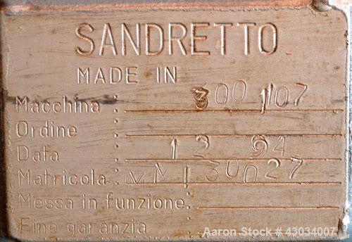Used Sandretto Micro30 30 Ton Hydraulic Horizontal Injection Mold Machine, Model 300/107. Approximate 1-3/4" diameter tie bars, 12" x 12" distance between bars, 17-3/4" x 17-3/4" platen size. Operato...