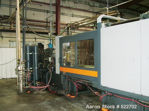 USED: Sandretto 610 ton, 138 oz, model TEW-610 plastic molding machine2001. Platen size 53" x 48"; distance between tie bars 37" x 33",min/max mold 12"/39", ejection stroke 13.8", dimensions 39.4" x ...