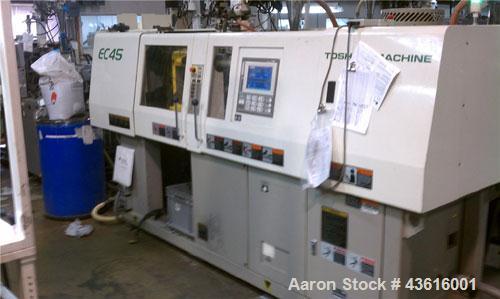 Used Toshiba Electric Injection Molding Machine, Model EC45-1A.  45 tons, shot size 1.59 oz, electric clamp, tie bar dist (H x V) 12.6" x 12.6".  Platen size (H x V) 18" x 18". Daylight min 5.9", max...