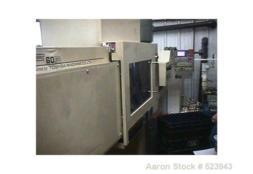 USED: Toshiba 60 ton, model ISF-60-P 1.5 B, injection molding machine, 3 oz. Manufactured 1996. Distance between tie bars 12.2" x 12.2". Platen 18.9" x 18.9". Clamp stroke 14.5". Daylight max/min 20....