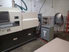 Used Milacron Roboshot 110 Ton Injection Molding Machine, Model S100i. Includes Moldmasters temp control Temp Master M2, Model #M2XS-12-MTS. Milacron Thermolator Model # MFCH7-75P. Dryer/hopper loadi...