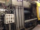 Used Uniloy 400 ton structural foam injection molding machine. 879 oz shot size HDPE foam, platen measures 67