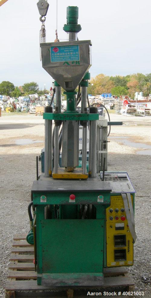 Used Ta So Machinery Vertical Injection Molder. (2) 2 1/2" diameter tie bars. Top platen 10 3/4" x 10 3/4". Driven by a 5 hp, 3/60/220/380 volt, 1160 rpm hydraulic power pack.