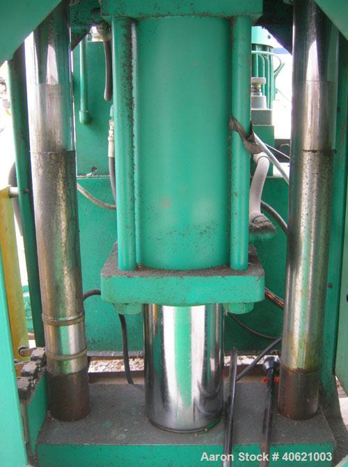 Used Ta So Machinery Vertical Injection Molder. (2) 2 1/2" diameter tie bars. Top platen 10 3/4" x 10 3/4". Driven by a 5 hp, 3/60/220/380 volt, 1160 rpm hydraulic power pack.