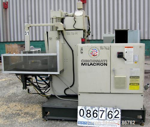 Used Cincinnati Milacron 70 Ton Vertical Rotary Insert Injection Molding Machine, Model Vector CH-70-R. Platen size approximately 10" x 16". 48" diameter, 4 station rotating table. Max daylight 19", ...