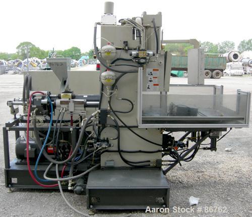 Used Cincinnati Milacron 70 Ton Vertical Rotary Insert Injection Molding Machine, Model Vector CH-70-R. Platen size approximately 10" x 16". 48" diameter, 4 station rotating table. Max daylight 19", ...