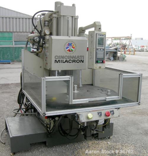 Used Cincinnati Milacron 70 Ton Vertical Rotary Insert Injection Molding Machine, Model Vector CH-70-R. Platen size approximately 10" x 16". 48" diameter, 4 station rotating table. Max daylight 19", ...