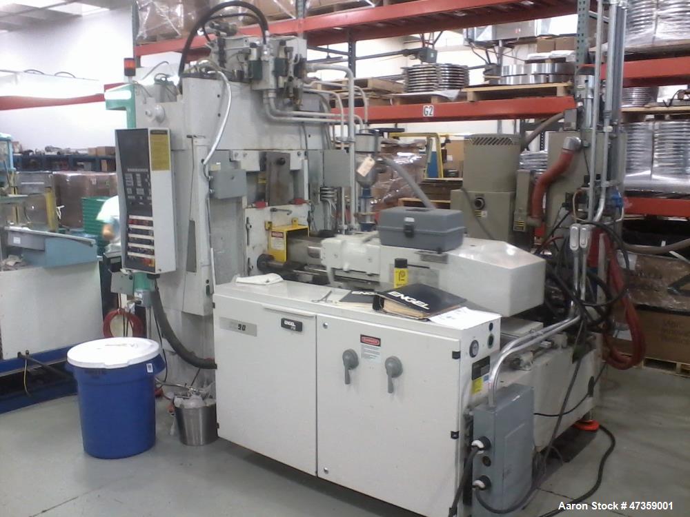 Used Engel Vertical Injection Molding Machine, Model 85 Rotary. 2 Station, 85 ton. Platen size 21.6" x 12.60". Daylight 9.8" min x 21.6" max. CC90 controls, 11.8" clamp stroke, 38" diameter table. 5....