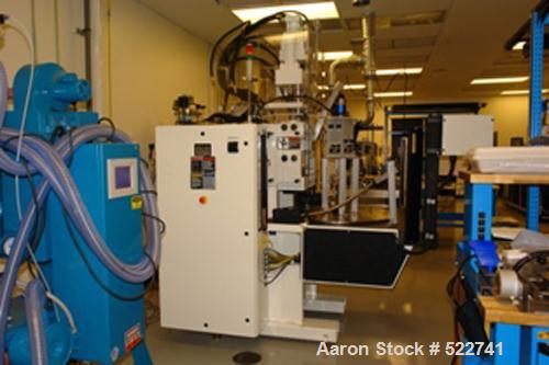 USED: C A Lawton Medi-Molder vertical insert molding machine. 30 ton; 0.77 oz; 20mm screw diameter; 4 sided, 8 zone, 8 outlet rotary table mold heat panel; mold heating and cooling capabilities; prog...