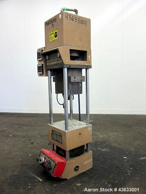 Used Morgan-Press Vertical Injection Molder, Model G100T. 20 Ton maximum clamping force, 0-800 degrees F temperature control range, 12,000 psi maximum injection pressure. 
