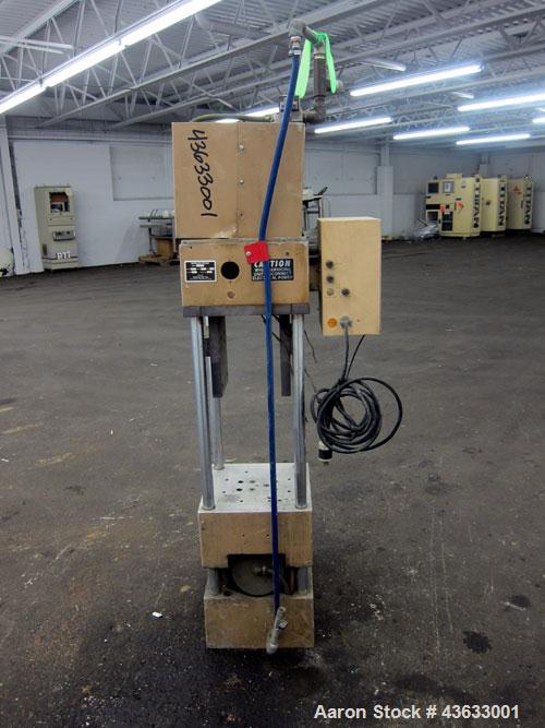Used Morgan-Press Vertical Injection Molder, Model G100T. 20 Ton maximum clamping force, 0-800 degrees F temperature control range, 12,000 psi maximum injection pressure. 
