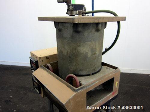 Used Morgan-Press Vertical Injection Molder, Model G100T. 20 Ton maximum clamping force, 0-800 degrees F temperature control range, 12,000 psi maximum injection pressure. 
