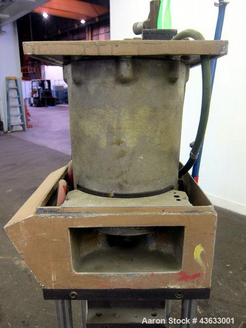 Used Morgan-Press Vertical Injection Molder, Model G100T. 20 Ton maximum clamping force, 0-800 degrees F temperature control range, 12,000 psi maximum injection pressure. 

