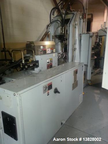 Used 80 Ton Newbury 4 Station Rotary Mold Machine, Model: 80VTCR5. Manufactured: 2000. Shot size: 5 ounce, platen size: 14" wide x 12" deep, stroke: 6.4" , daylight: 20.38" mold size: 14" x 12". Tabl...