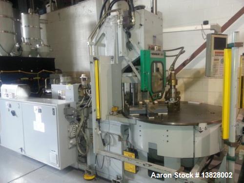 Used 80 Ton Newbury 4 Station Rotary Mold Machine, Model: 80VTCR5. Manufactured: 2000. Shot size: 5 ounce, platen size: 14" wide x 12" deep, stroke: 6.4" , daylight: 20.38" mold size: 14" x 12". Tabl...