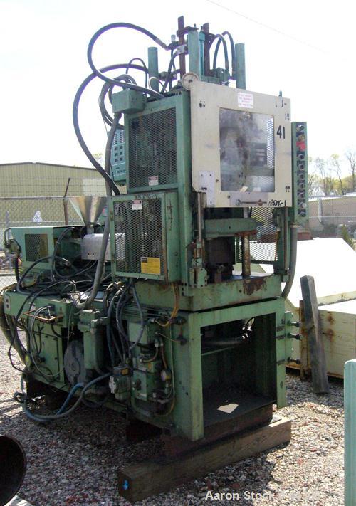 USED: Newbury 75 ton vertical injection molder. Has 9 ounce shotcapacity with vertical clamp including 12" x 12" tie bar clearnace.Includes operator control panel with temperature controls. ModelV9-7...