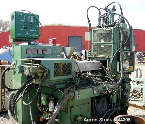 USED: Newbury 75 ton vertical injection molder. Has 9 ounce shotcapacity with vertical clamp including 12" x 12" tie bar clearnace.Includes operator control panel with temperature controls. ModelV9-7...
