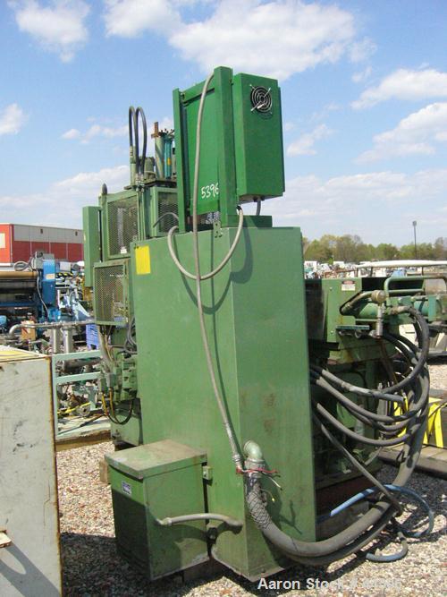 USED: Newbury 75 ton vertical injection molder. Has 9 ounce shotcapacity with vertical clamp including 12" x 12" tie bar clearnace.Includes operator control panel with temperature controls. ModelV9-7...