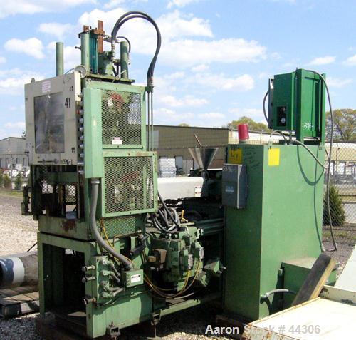 USED: Newbury 75 ton vertical injection molder. Has 9 ounce shotcapacity with vertical clamp including 12" x 12" tie bar clearnace.Includes operator control panel with temperature controls. ModelV9-7...
