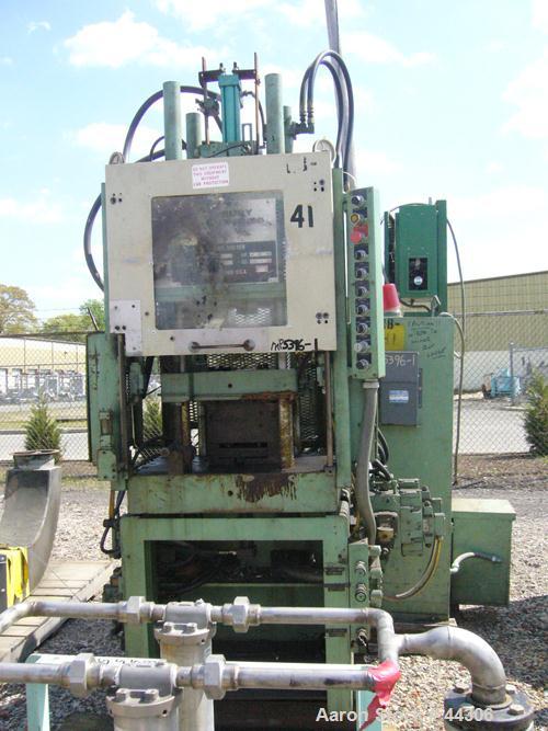 USED: Newbury 75 ton vertical injection molder. Has 9 ounce shotcapacity with vertical clamp including 12" x 12" tie bar clearnace.Includes operator control panel with temperature controls. ModelV9-7...