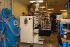 USED: C A Lawton Medi-Molder vertical insert molding machine. 30 ton; 0.77 oz; 20mm screw diameter; 4 sided, 8 zone, 8 outlet rotary table mold heat panel; mold heating and cooling capabilities; prog...