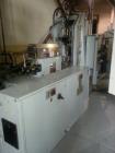 Used 80 Ton Newbury 4 Station Rotary Mold Machine, Model: 80VTCR5. Manufactured: 2000. Shot size: 5 ounce, platen size: 14