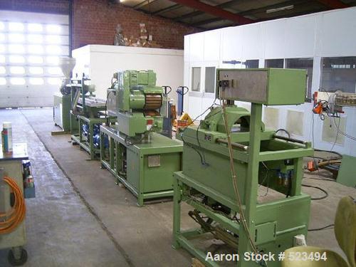 USED: PVC profile line. Cincinnati CMT-35 twin screw extruder, screwdiameter 1.38" to 2.95" (35-75mm) conical, screw length 31" (790mm),DC motor 9 kw. Includes monitor control, Dozer DOT-35, vacuum p...