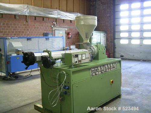 USED: PVC profile line. Cincinnati CMT-35 twin screw extruder, screwdiameter 1.38" to 2.95" (35-75mm) conical, screw length 31" (790mm),DC motor 9 kw. Includes monitor control, Dozer DOT-35, vacuum p...