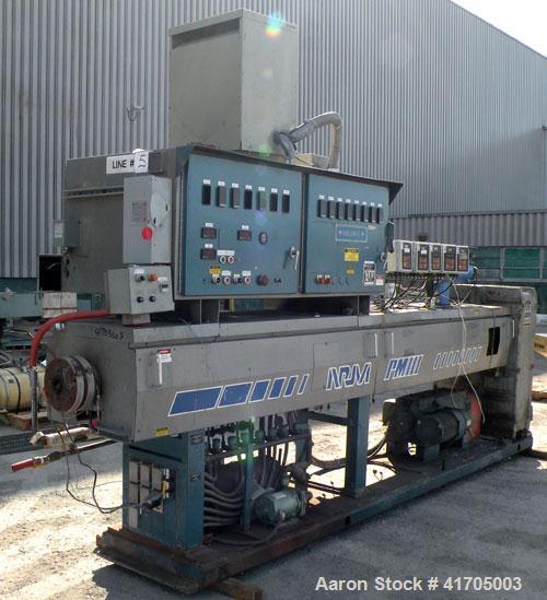 Used McNeil / NRM Profile Extrusion Line consisting of: (1) McNeil/NRM 4-1/2" single screw extruder, model 4.5 Pacemaker III32-1 RH/WC, 32 to 1 L/D ratio, electrically heated, water cooled non-vented...