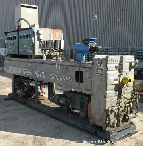 Used McNeil / NRM Profile Extrusion Line consisting of: (1) McNeil/NRM 4-1/2" single screw extruder, model 4.5 Pacemaker III32-1 RH/WC, 32 to 1 L/D ratio, electrically heated, water cooled non-vented...