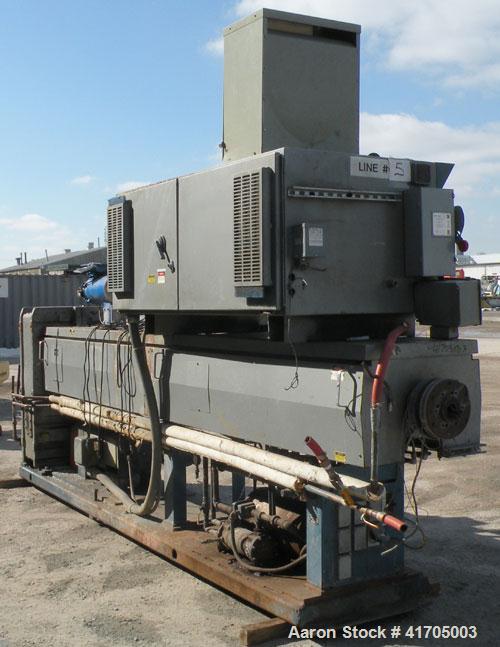 Used McNeil / NRM Profile Extrusion Line consisting of: (1) McNeil/NRM 4-1/2" single screw extruder, model 4.5 Pacemaker III32-1 RH/WC, 32 to 1 L/D ratio, electrically heated, water cooled non-vented...